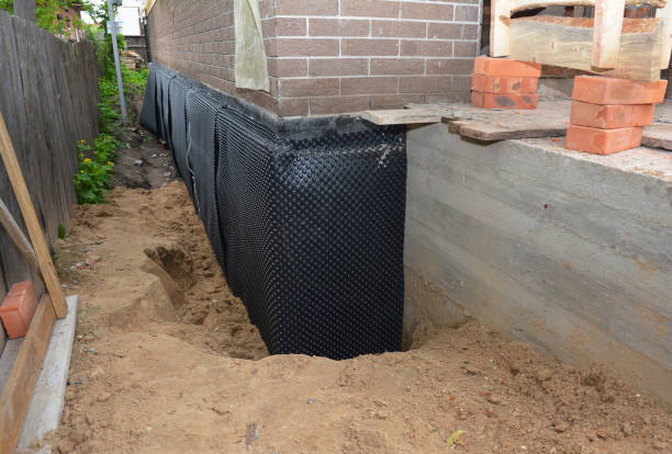Happy homeowners after waterproofing job in Marbury